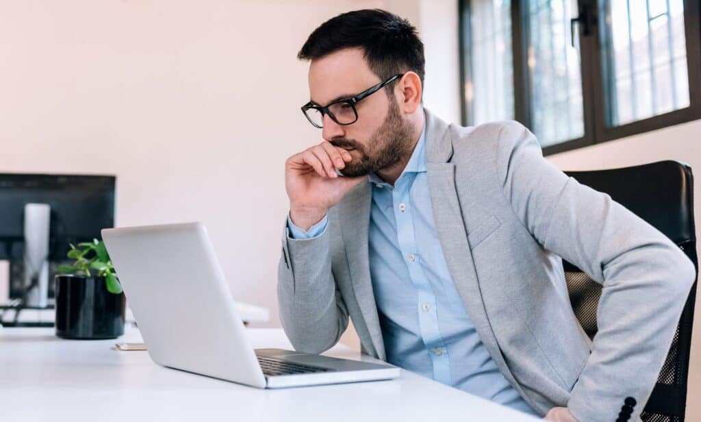 looking at laptop intently