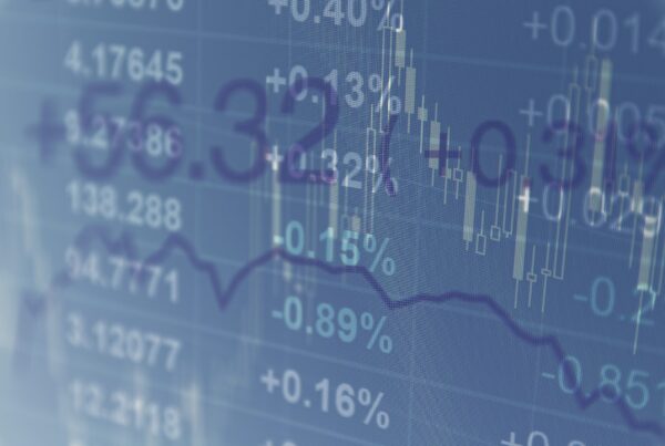 Close-up computer monitor with trading software. Multiple exposure photography.